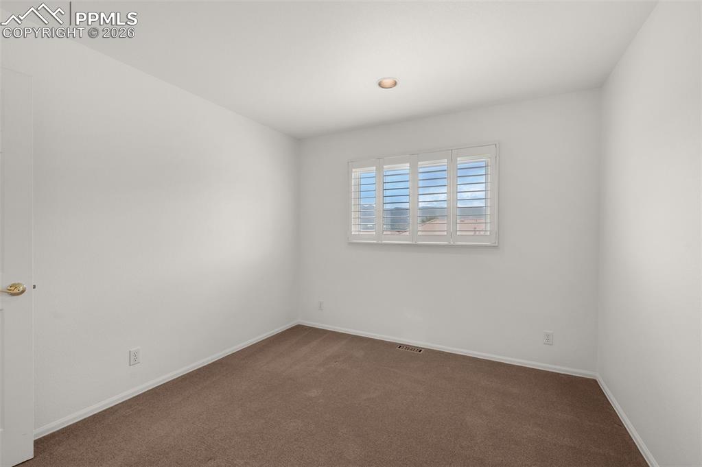 Image 37 of 50: Upper Level Bedroom