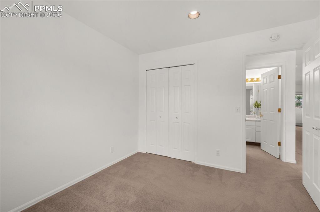 Image 38 of 50: Upper Level Bedroom