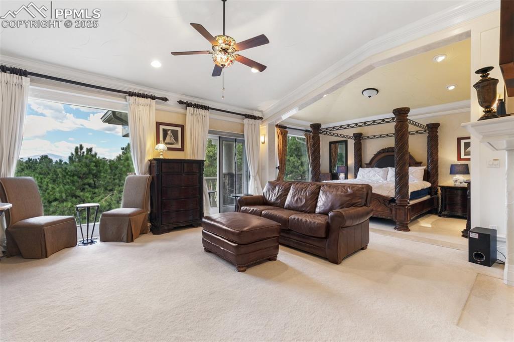 Image 27 of 50: Carpeted bedroom with crown molding, access to outside, recessed lighting, 