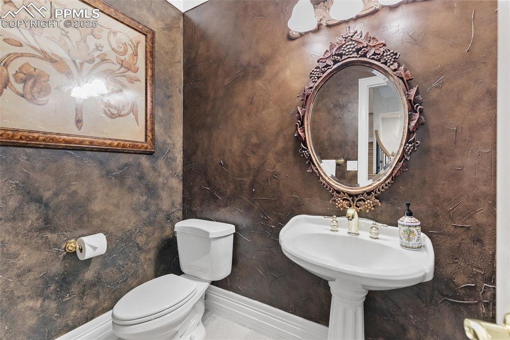 Image 50 of 50: Bathroom with toilet and baseboards