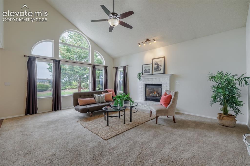 Image 14 of 41: Fireplace in the family room is cozy on winter evenings