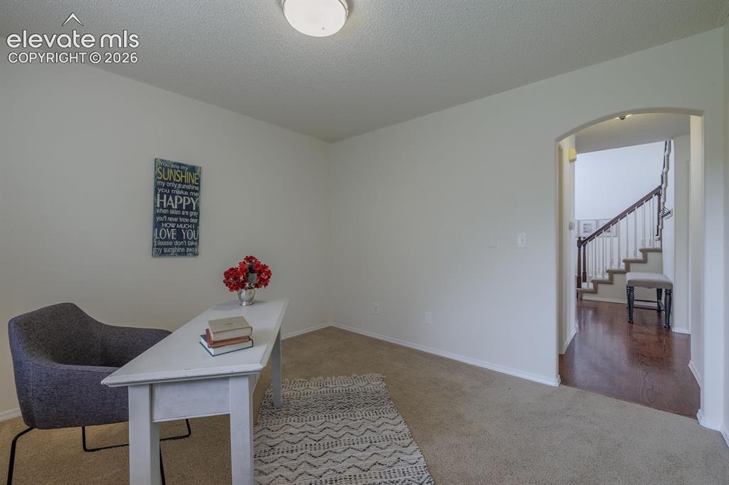 Image 16 of 41: Office off of family room; great space tucked away on the main level