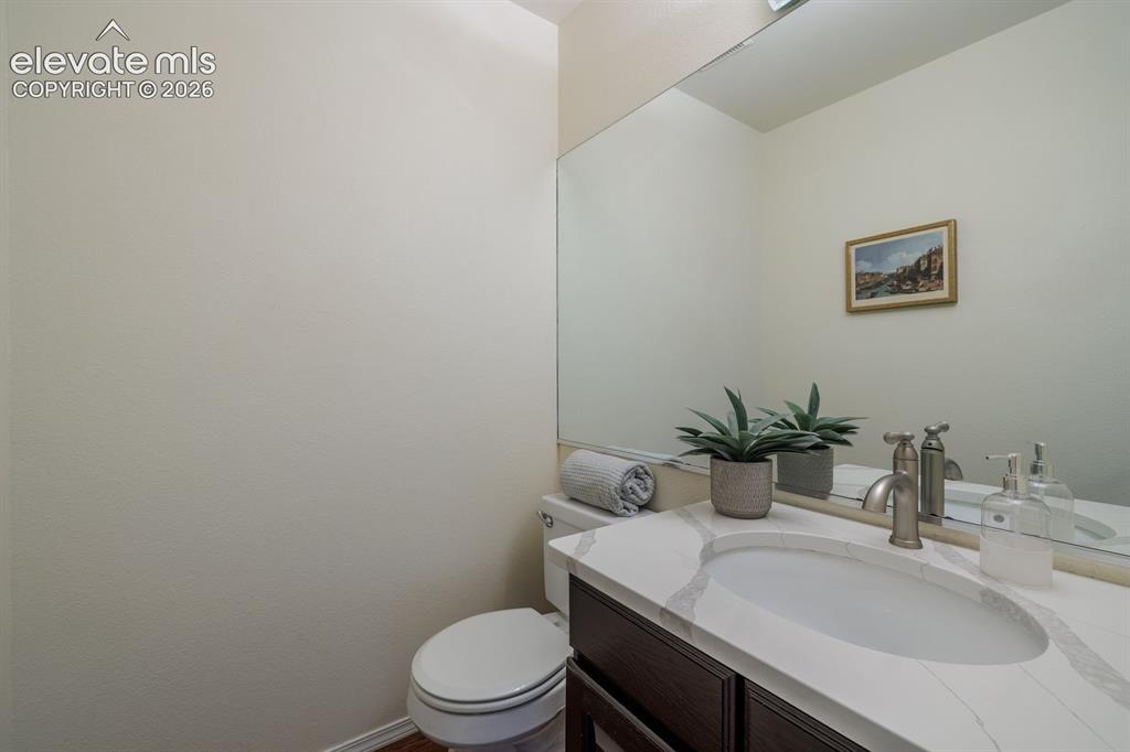 Image 17 of 41: Powder room off the office and adjacent to the laundry room