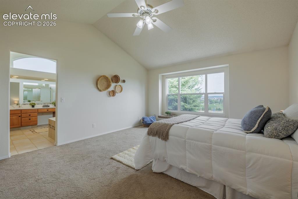 Image 19 of 41: window seat in primary bedroom light and bright and very private