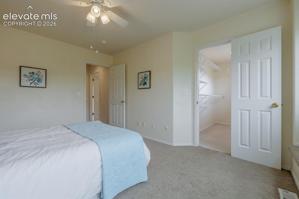 Image 27 of 41: Upstairs full bah with quartz countertop serves both additional bedrooms