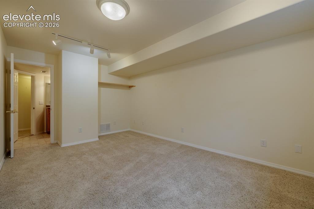 Image 35 of 41: Expansive mature, flat yard off of kitchen and family room