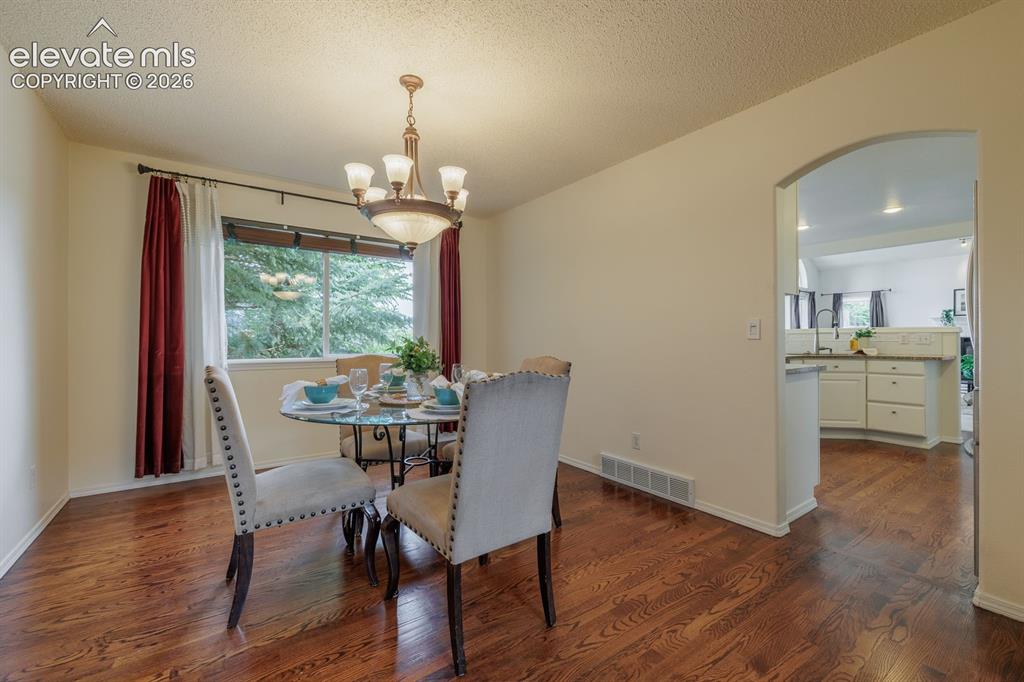 Image 7 of 41: Dining to kitchen light and bright