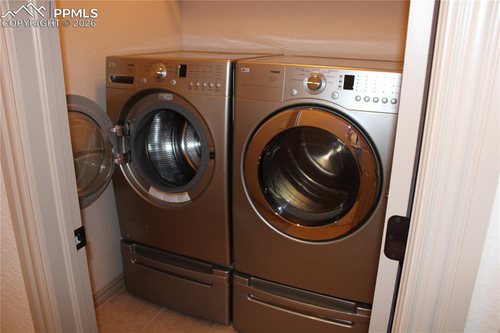 Image 25 of 49: Laundry next to Primary Suite