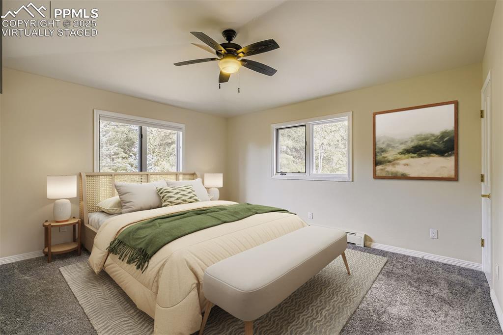 Image 26 of 35: Virtually Staged! Bedroom featuring multiple windows, new carpet, and a cei