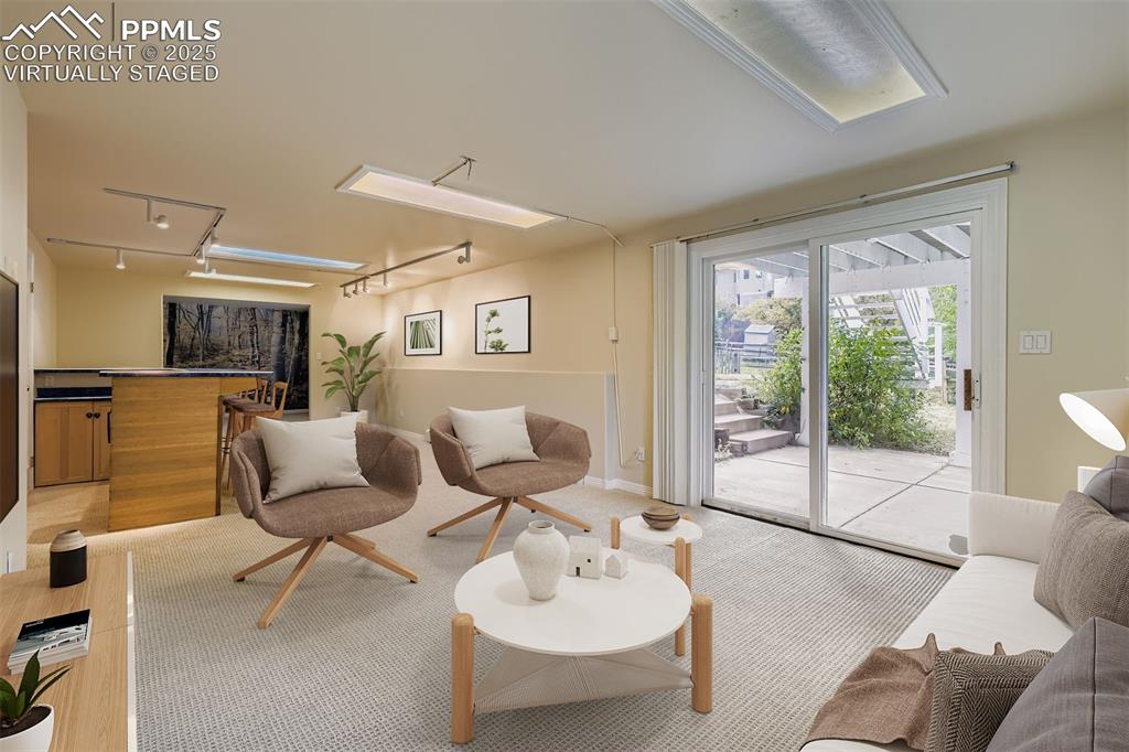 Image 30 of 35: Virtually Staged!
Family/Recreation room in basement with rail lighting,
