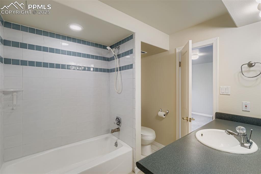 Image 33 of 35: Full bath with shower / bathtub combination, vanity, and recessed lighting