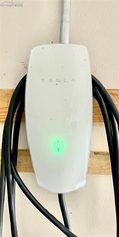 Image 35 of 35: TESLA charger (garage)