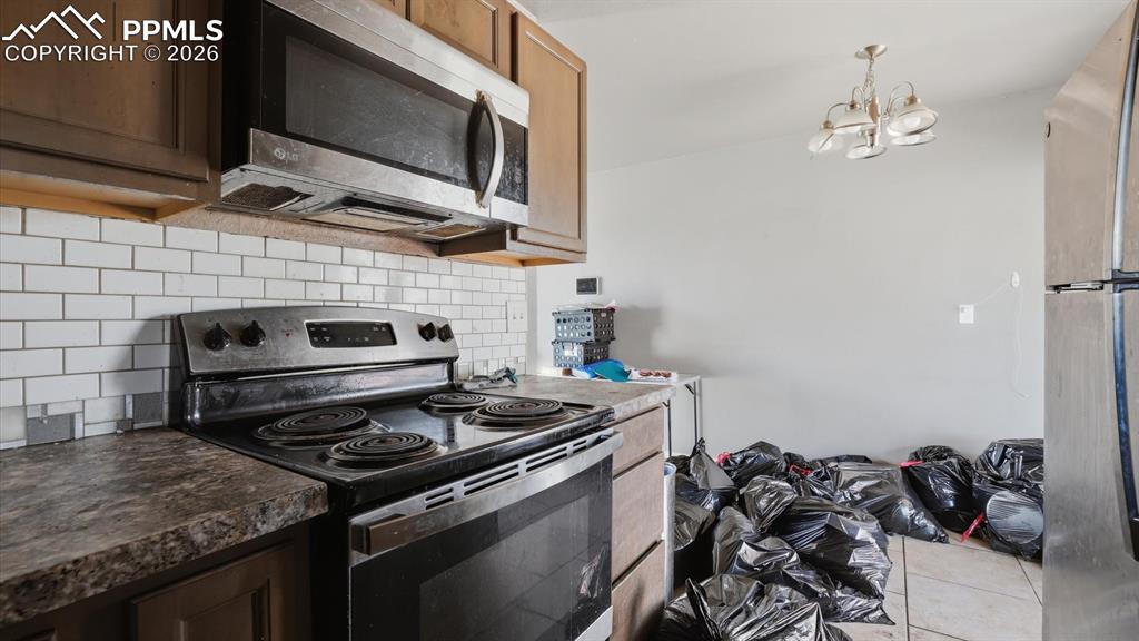 Image 10 of 30: View of the Dining Area from the Kitchen.