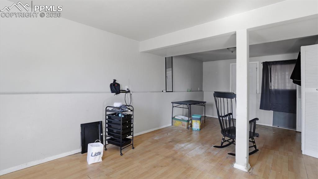 Image 22 of 30: From the Family Room, step outside to a covered patio and the level, fenced