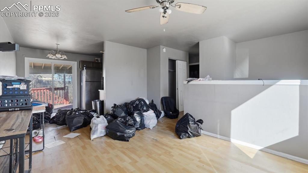 Image 5 of 30: The Living Room flows seamlessly into the Dining Area with slider to a cove