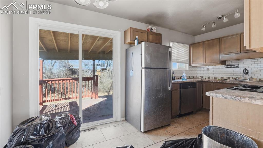 Image 6 of 30: The Dining Area flows into the Kitchen making it easy for food service and 