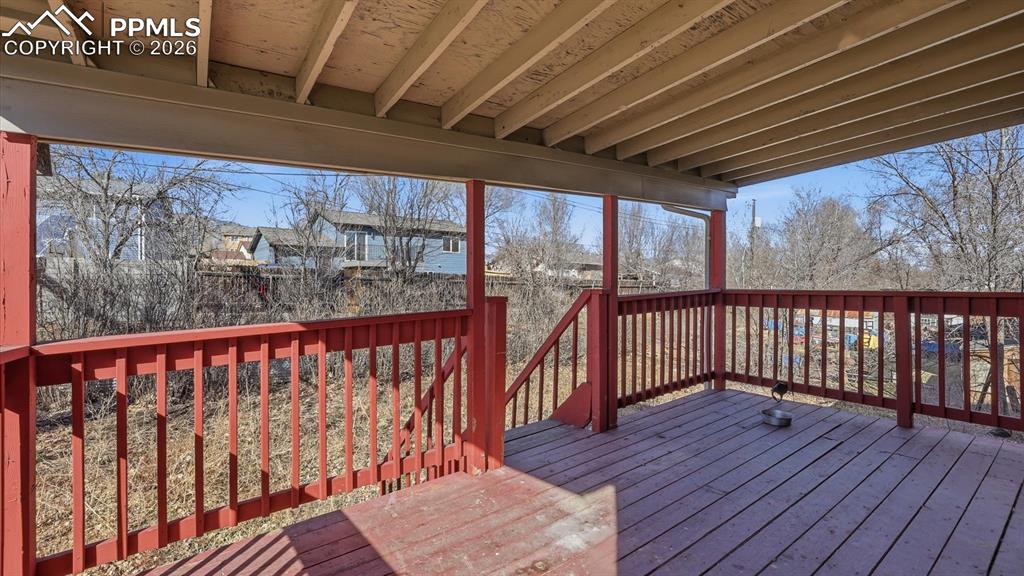 Image 7 of 30: Covered deck located off the Dining Area for outdoor dining and relaxation.