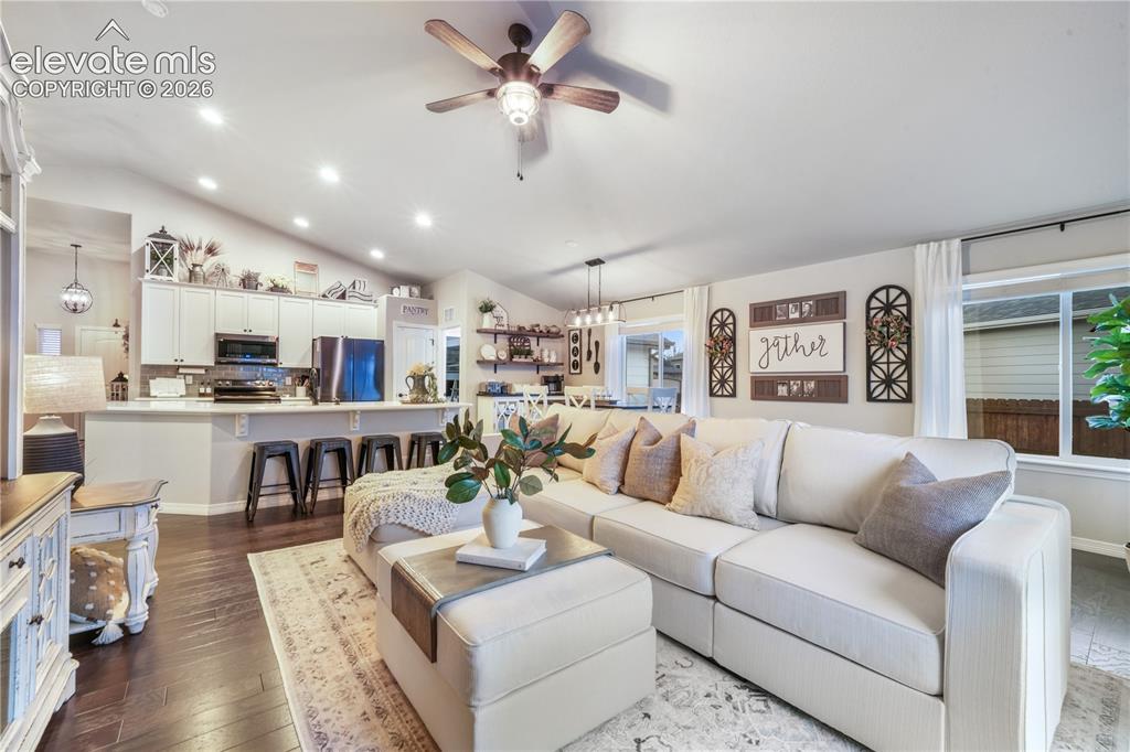 Image 10 of 50: Vaulted ceilings with a ceiling fan, recessed lighting, wood-finish floorin
