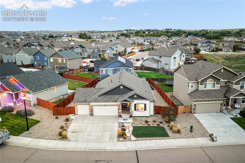 Image 48 of 50: Single-family residence featuring a two-car garage, concrete driveway, and