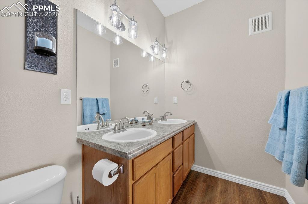 Image 17 of 26: Primary bath with double vanity