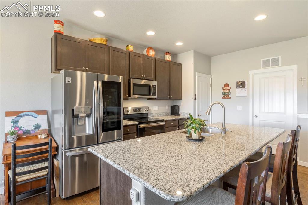 Image 10 of 28: The spacious kitchen provides easy access to the laundry room and attached 