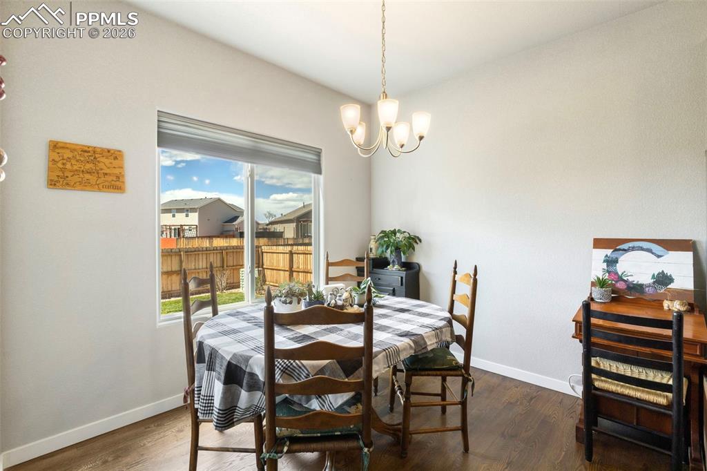 Image 11 of 28: Gather around the table in the dining area, flooded with lots of natural li