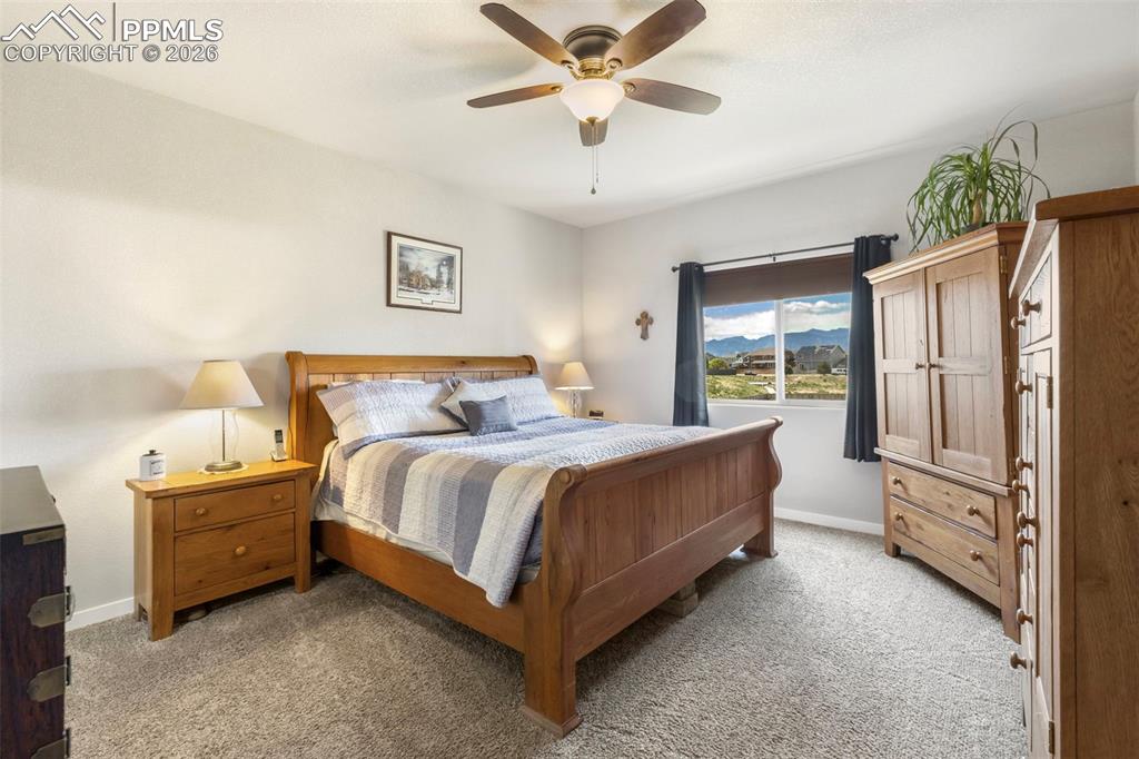Image 13 of 28: Retreat to the primary suite, featuring gorgeous mountain views, a 5-piece 