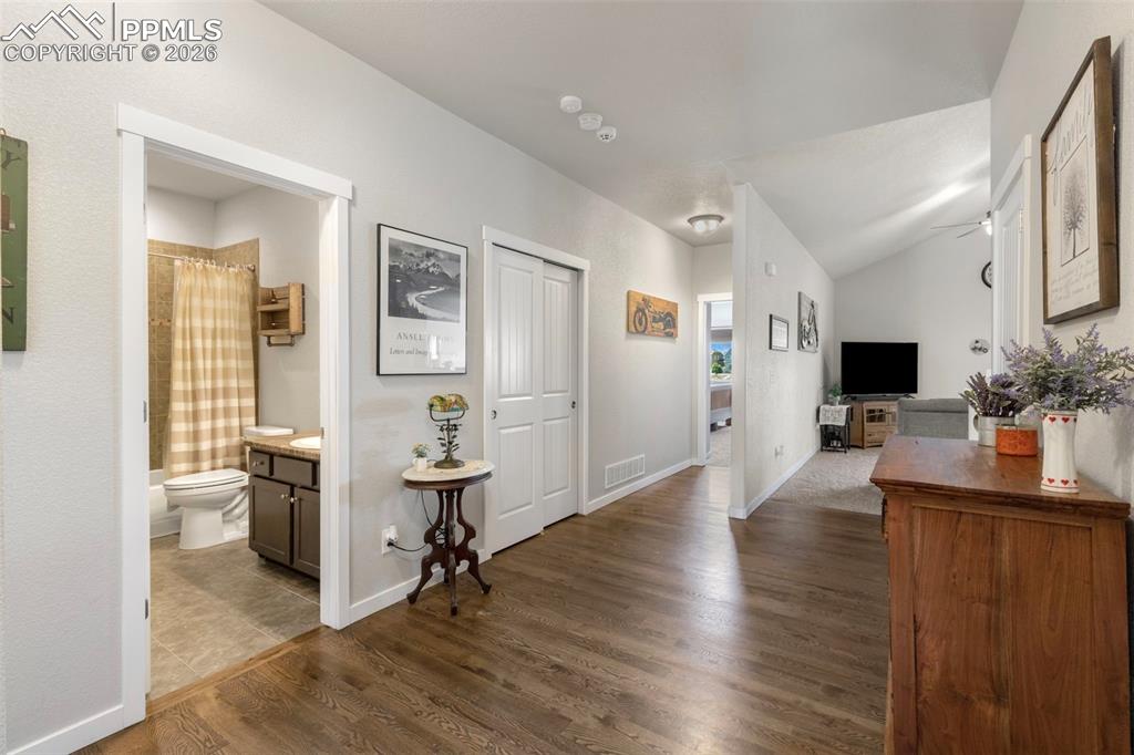 Image 5 of 28: Step inside the beautiful entry with hardwood floors and two closets for to