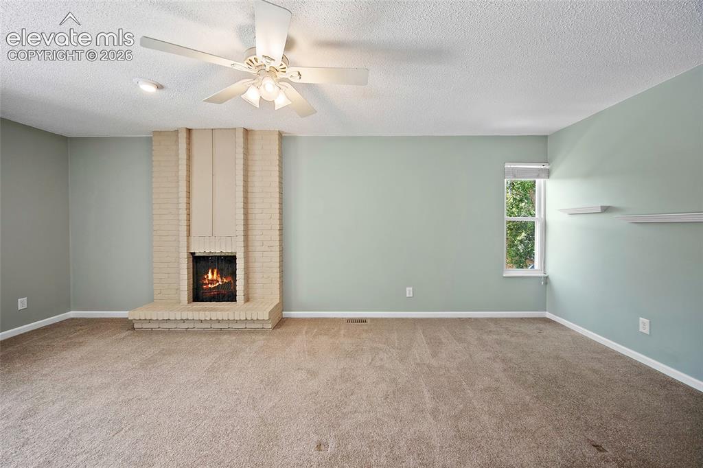 Image 34 of 50: With fireplace and Balcony
