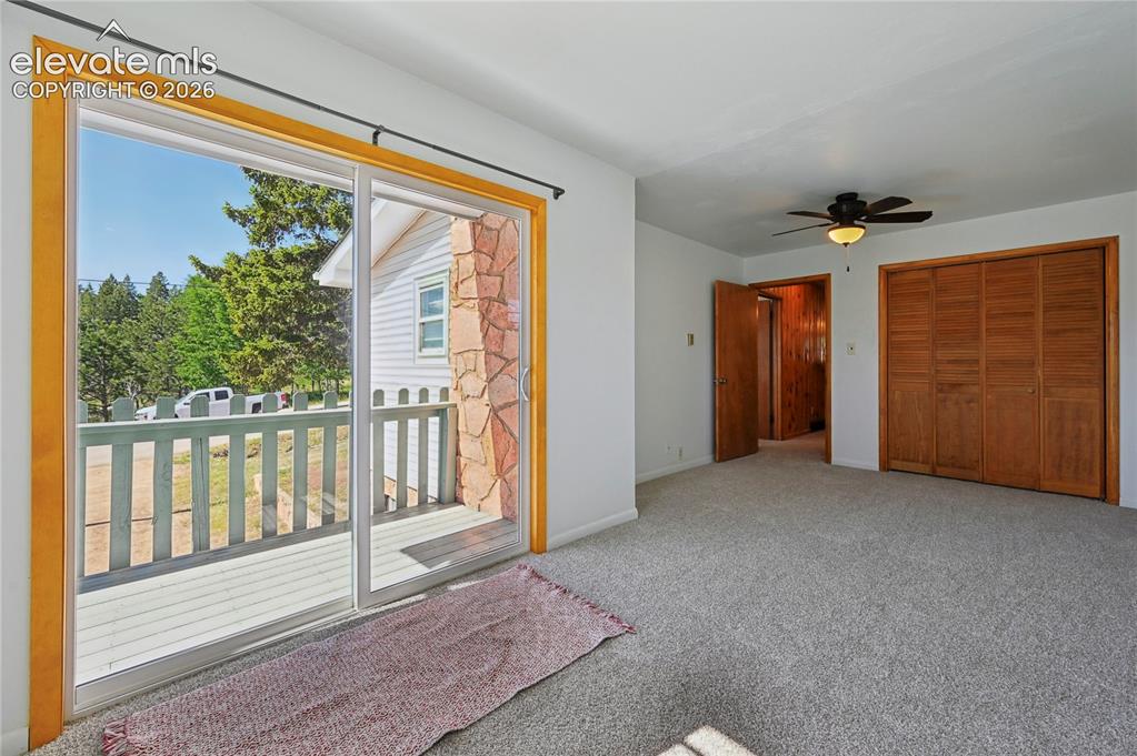 Image 14 of 45: The main level primary bedroom has its own private balcony and a double-siz
