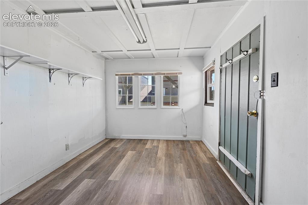 Image 21 of 45: Outside, ground-level entrance, mud room, and coat room for the lower level