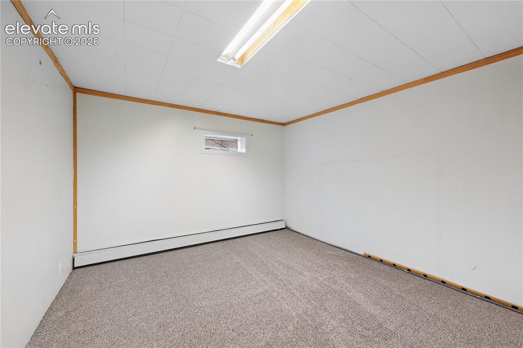 Image 29 of 45: Basement bedroom is #4 in the home and makes the basement feel like its own