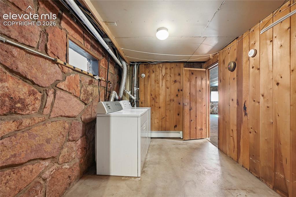 Image 32 of 45: This very large, shareable laundry room is in-between the upstairs and down