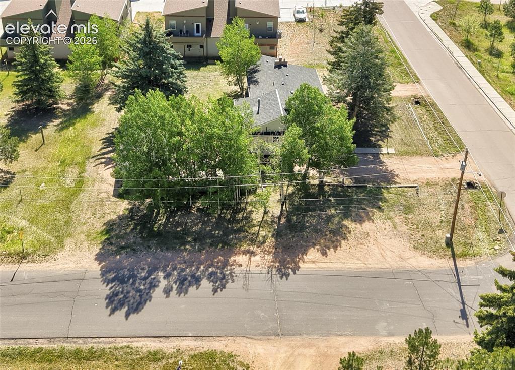 Image 36 of 45: Three driveways and plenty of off-street parking on this quarter-acre corne