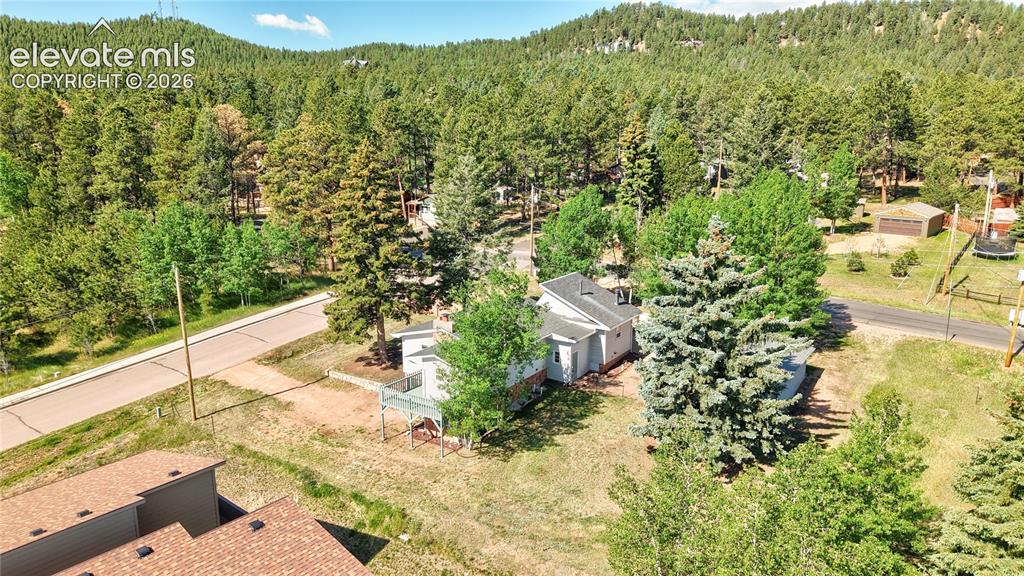 Image 41 of 45: This quarter acre property is at the edge of the woods and the edge of town