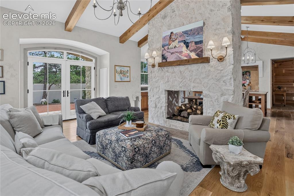 Image 10 of 46: Living room w/ gas log fireplace & walk-out