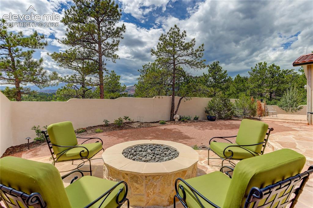 Image 11 of 46: Private back patio w/ firepit & mountain views