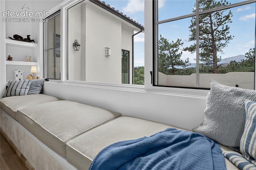 Image 13 of 46: Window seat with views to mountains