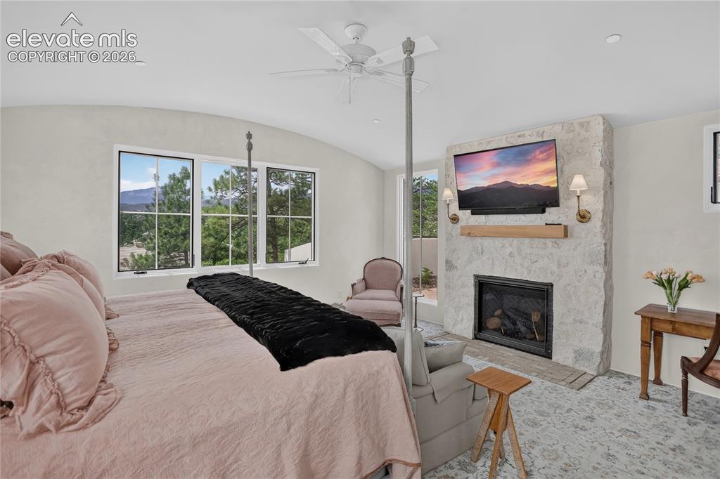 Image 22 of 46: Mountain views & stone surround fireplace