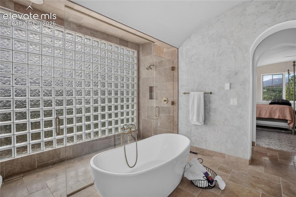 Image 24 of 46: Soaking tub & zero-entry shower with dual entrances