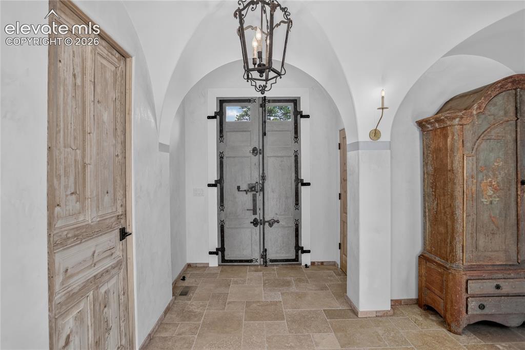 Image 3 of 46: Entryway features 1700s era French door