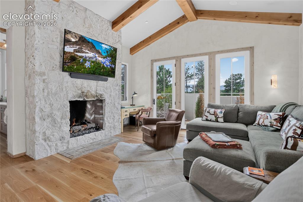Image 32 of 46: Spacious den features fireplace & walk-out