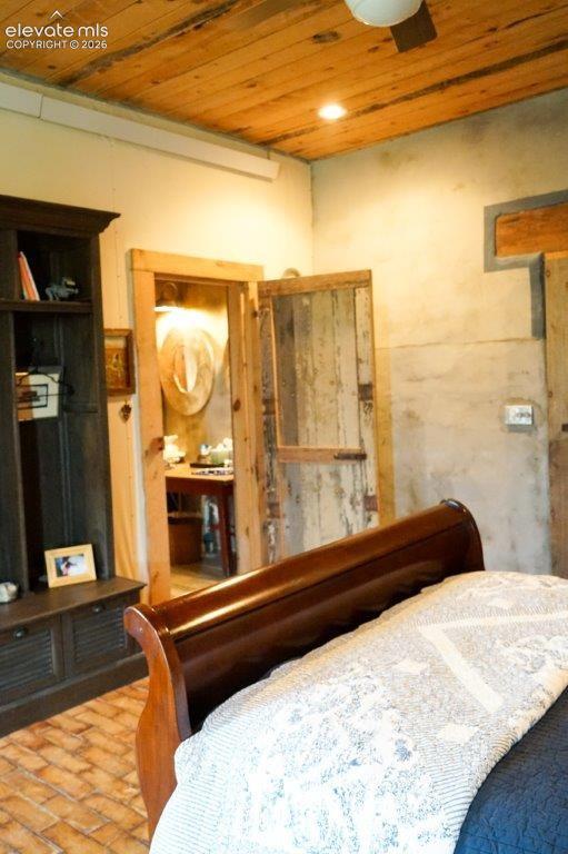 Image 29 of 50: Distressed wood ceiling featuring recessed lighting