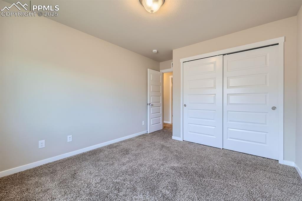 Image 13 of 31: Unfurnished bedroom featuring carpet flooring and a closet