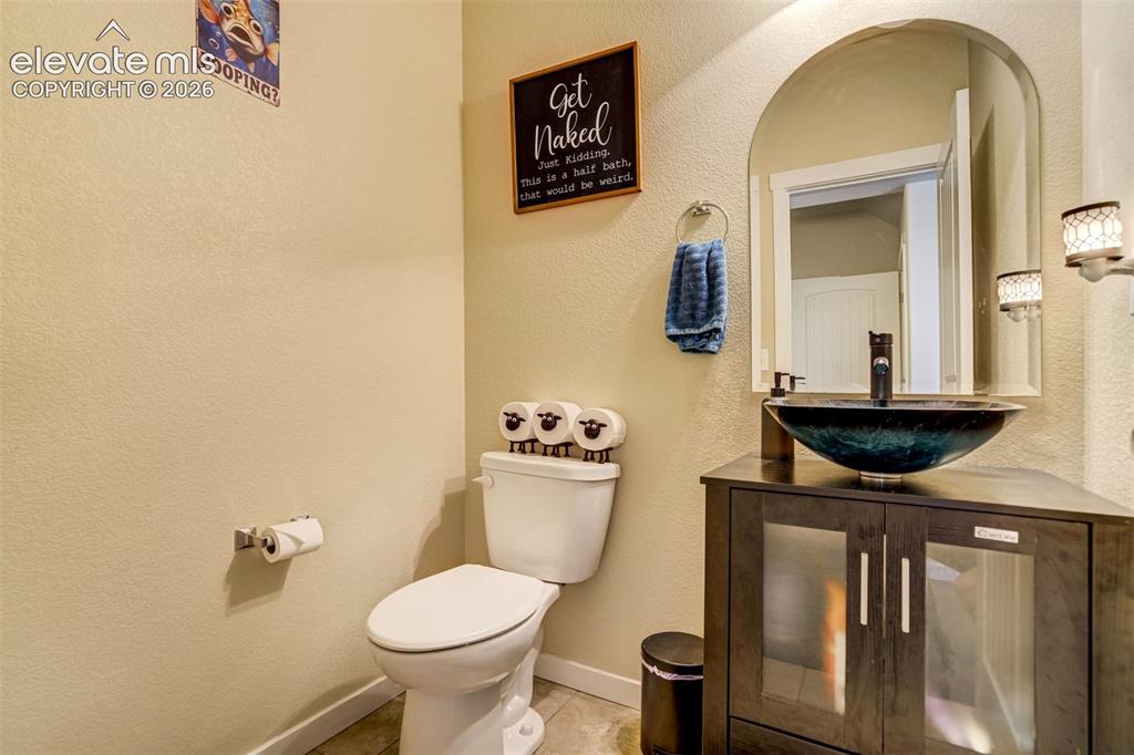 Image 12 of 42: Main level half bath.