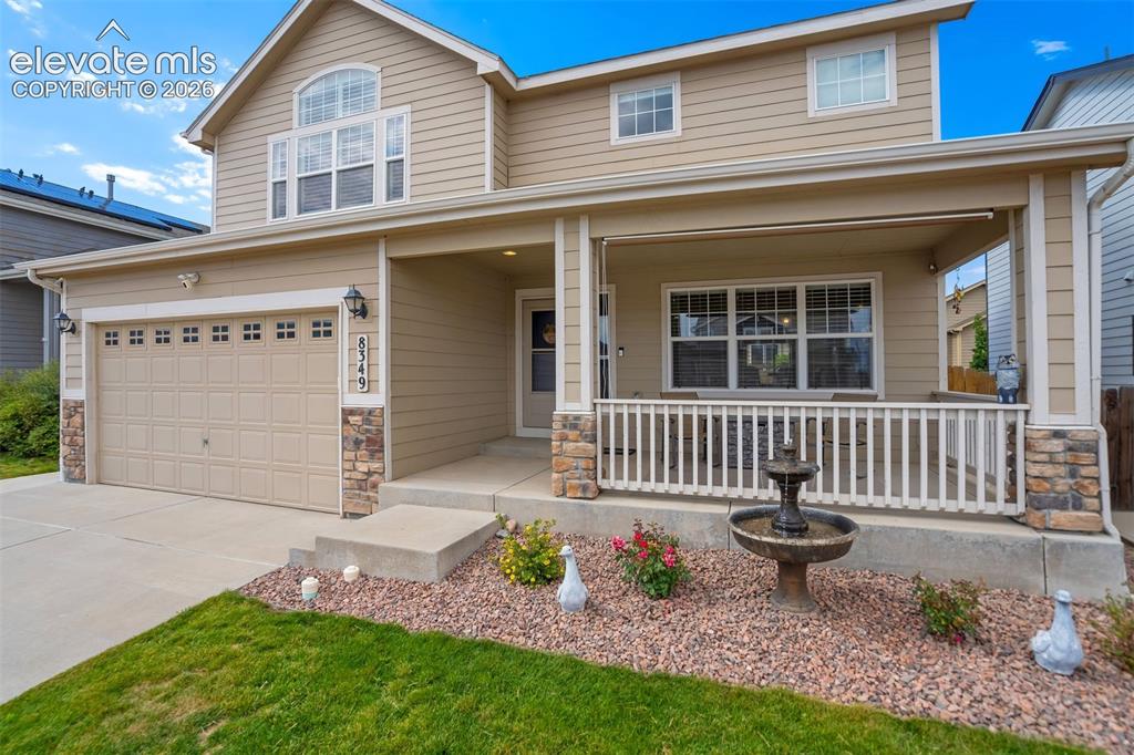 Image 2 of 42: Inviting covered front porch.