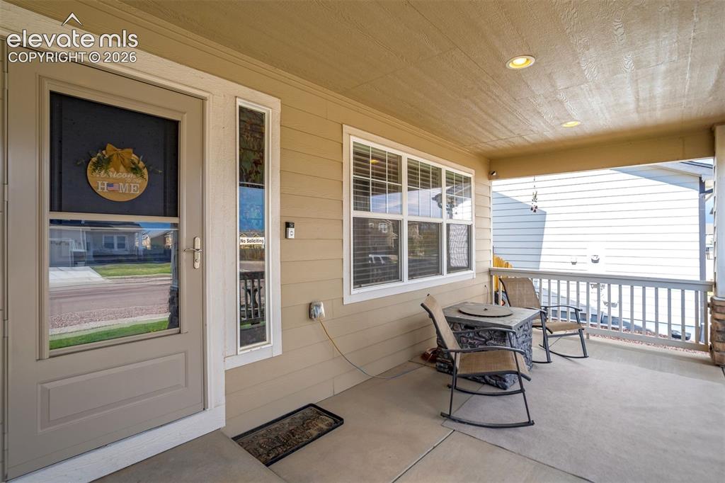 Image 3 of 42: Large covered front porch/entry.