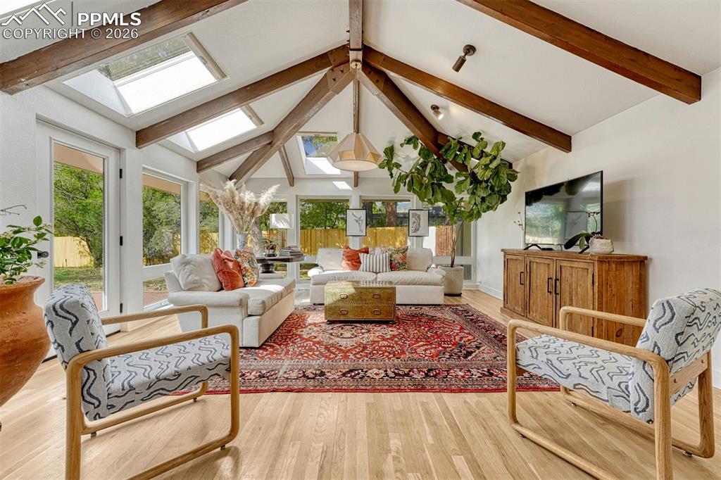 Image 4 of 50: Gorgeous sunfilled sunroom with walk out to private patio