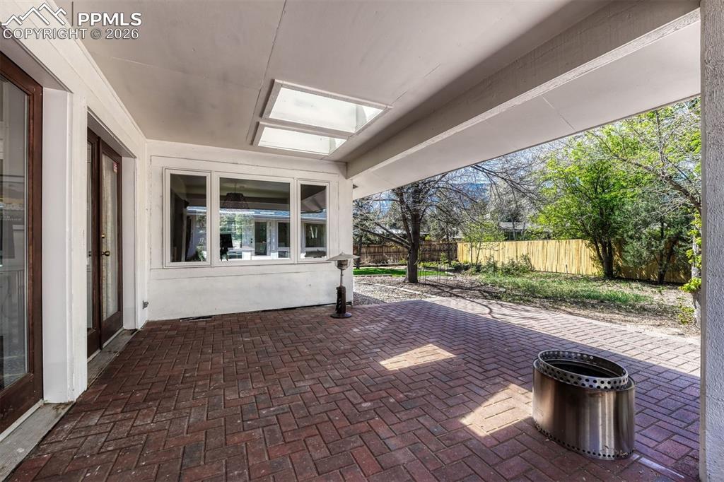Image 45 of 50: A private patio extends from the living area, junior suite, and sunroom, cr