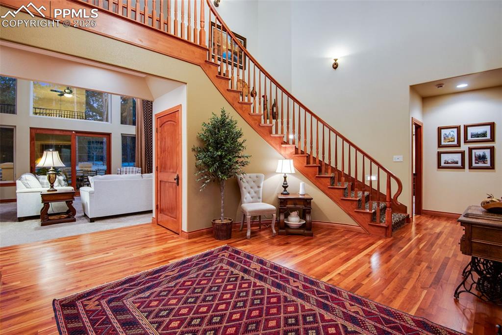 Image 11 of 42: Staircase to the three upper bedrooms with ensuites